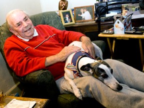 Stuart Andrew, also known as Grumpy, sits with his pet whippet, Twiggy, in his  home in the west end of Windsor, Ont., on Sunday, Nov. 24, 2013, that was involved in a break and enter on Thursday, Nov. 21,.