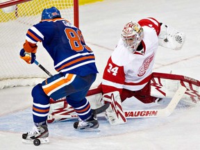 Detroit Red Wings goalie Petr Mrazek (34) makes the save on Edmonton Oilers Sam Gagner (89) during third period NHL hockey action in Edmonton on Saturday November 2, 2013. (THE CANADIAN PRESS/Jason Franson)