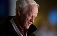 Hockey great Gordie Howe watches the Vancouver Canucks and San Jose Sharks play during an NHL hockey game in Vancouver on  Nov. 14, 2013. (THE CANADIAN PRESS/Darryl Dyck)