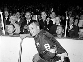 In this Nov. 10, 1963 file photo, the Detroit Red Wings' Gordie Howe (9) acknowledges applause from the fans during a 20-minute standing ovation after he scored the 545th goal of his National Hockey League career at Detroit's Olympia Stadium, to set the leagues' all-time scoring mark. The NHL has the best names in the business. Nicknames, that is. Little Ball of Hate. The Great One. Tazer. Bicksy. Howe is known as the "Mr. Hockey." (AP Photo/File)