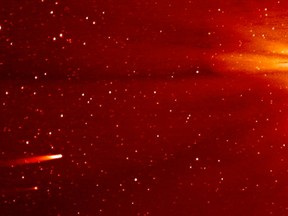 In this frame grab taken from enhanced video made by NASA's STEREO-A spacecraft, comet ISON, left, approaches the sun on Nov. 25, 2013. Comet Encke is shown just below ISON, The sun is to the right, just outside the frame. ISON, which was discovered a year ago, is making its first spin around the sun and will come the closest to the super-hot solar surface on Thanksgiving Day, Thursday, Nov. 28, 2013, at 1:37 p.m. EST. (AP Photo/NASA)