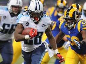 Chris Johnson #28 of the Tennessee Titans runs against the St. Louis Rams in the fourth quarter at the Edward Jones Dome on November 3, 2013 in St. Louis, Missouri.  (Michael Thomas/Getty Images)