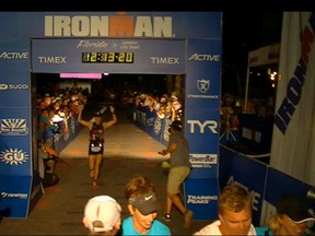 Windsor Star fitness writer Kelly Steele crosses the finish line at the Florida Ironman Triathlon. (Photo Courtesy of John-Paul Bonadonna)