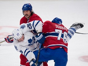 Toronto's Colton Orr, centre, gets caught in between Montreal's George Parros, left, and P.K. Subban Saturday in Montreal. (THE CANADIAN PRESS/Paul Chiasson)