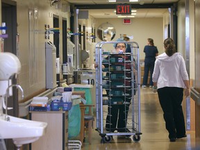 In this file photo, Windsor Regional Hospital Ouellette Campus staff work on a cluttered sixth floor hallway in a cardiology section, Monday, Nov. 25, 2013, in Windsor, Ont.  (DAN JANISSE/The Windsor Star)