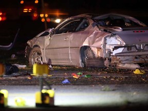 The wrecked car involved in a single-vehicle accident rests on the northeast side of the intersection of Front Road North and Middle Side Road in Amherstburg, Ont., Sunday, Nov. 3, 2013.  Two males were sent to hospital with unknown injuries.  (DAX MELMER/ The Windsor Star)