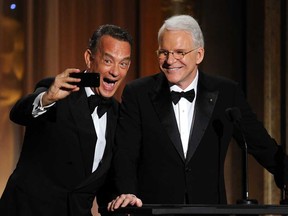 Actor Tom Hanks presents Honoree Steve Martin with honorary award onstage during the Academy of Motion Picture Arts and Sciences' Governors Awards at The Ray Dolby Ballroom at Hollywood & Highland Center on November 16, 2013 in Hollywood, California.  (Kevin Winter/Getty Images)