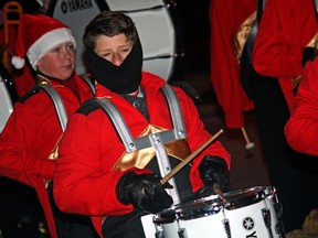 A drummer bundles up during the cold Santa Claus Parade that travelled down the main streets in Amherstburg Saturday, Nov. 23, 2013. (JOEL BOYCE/The Windsor Star)