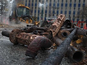 Old steam pipes lie in the parking lot south of City Hall in Windsor, Ont., where construction is being done, Monday, Nov. 11, 2013.  (DAX MELMER/The Windsor Star)