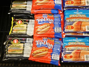 In this file photo, Shopsy's Deli-Fresh All Beef Frankfurters, shown in meat cooler display at left,  and Maple Leaf Hot Dogs Original were recalled by Maple Leaf Foods Tuesday, Feb. 24, 2009.   (Photo By Peter J. Thompson/National Post)