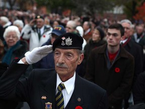 James G. Chilman, 74, holds his salute during the Remembrance Day ceremony at the cenotaph in downtown Windsor, Monday, Nov. 11, 2013.  Chilman, a member of The Royal Canadian Legion, Branch 26 in Tecumseh, served with NATO during the Cold War.  (DAX MELMER/The Windsor Star)