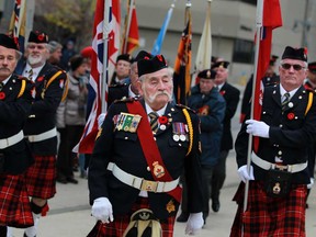 The colour guard carries the colours to open up the Remembrance Day ceremony at the cenotaph in downtown Windsor, Monday, Nov. 11, 2013.   (DAX MELMER/The Windsor Star)