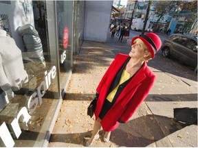 Wynn Putnam looks over possibilities for work along Robson Street in Vancouver. She is 69 and has some tips for those over 65 looking for work in a young world. (Steve Bosch, PNG)