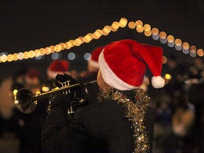 A trumpet player performs for thousands at the 2012 Windsor Santa Claus Parade on Riverside Drive Saturday, December 1, 2012.        (KRISTIE PEARCE / The Windsor Star)