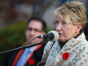 Theresa Charbonneau, whose son Andrew Grenon died in Afghanistan, gives a heartfelt speech to nearly a hundred people protesting the closure of a Windsor district Veterans office, outside City Hall, Friday Nov. 8, 2013. (DAX MELMER/The Windsor Star)
