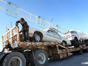 Anthony Hamlin loads up the Windsor Raceway pace car and a water truck, Wednesday, Nov. 13, 2013, that were purchased from an auction at the shuttered track.  (DAN JANISSE/The Windsor Star)
