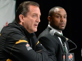 Hamilton Tigers-Cats coach Kent Austin, left, and Saskatchewan Roughriders coach Corey Chamblin meet at the Delta Regina. (Don Healy/Leader-Post)