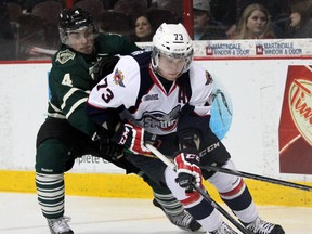 Windsor's Remy Giftopoulos, right, is checked by London's Mike Liberati at the WFCU Centre. (JOEL BOYCE/The Windsor Star)