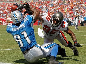 Detroit's Calvin Johnson, left, catches a touchdown  pass against Tampa Bay's Aqib Talib. (Photo by Mike Ehrmann/Getty Images)