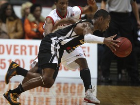 Windsor's Stefan Bonneau, top, guards London's Jaytornah Wisseh during the Express home opener at the WFCU Centre. (DAN JANISSE/The Windsor Star)