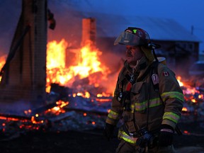 File photo of Lakeshore firefighters battling a blaze which totally destroyed a single family home at 978 Scott Side Road Monday November 25, 2013.  The resident of the home escaped the flames. (NICK BRANCACCIO/The Windsor Star)