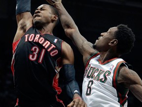 Toronto's Terrence Ross, left, is fouled by Milwaukee's Larry Sanders. (AP Photo/Morry Gash)