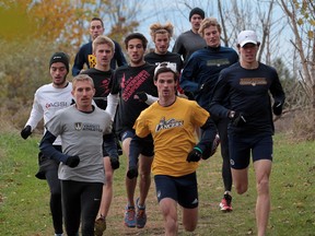 Members of the University of Windsor's cross-country team work out at Malden Park. (JASON KRYK/The Windsor Star)