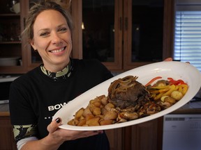 Melanie Gariepy displays her recently cooked piece of moose meat at her home in Lakeshore. (DAX MELMER / The Windsor Star)