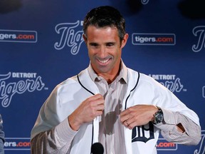 Brad Ausmus is introduced as the new Detroit Tigers manager during a news conference in Detroit Sunday, Nov. 3, 2013. (AP Photo/Paul Sancya)