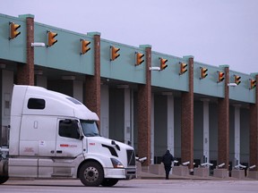 A truck passes through the border crossing at the Ambassador Bridge in Windsor, Ont., is pictured Tuesday, Nov. 26, 2013.  (DAX MELMER/The Windsor Star)