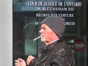 Former Windsor-Essex crown attorney Bruce Coates leaves the Ontario Court of Justice, Thurs. Nov. 14, 2013, in Windsor, Ont.  (DAN JANISSE/The Windsor Star)