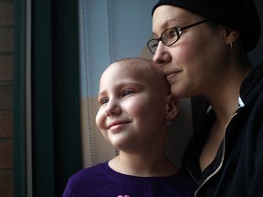 Lisa Andre waits for a doctor with her daughter, Aubri Andre, 7, left, in a hospital room at Windsor Regional Hospital - Metropolitan Campus, Friday, Nov. 15, 2013.  Community support for Aubri and her family continues to pour in.  (Windsor Star files)