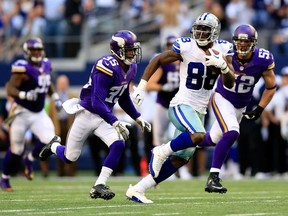 Wide receiver Dez Bryant, right, of the Dallas Cowboys carries the ball down the field against the Minnesota Vikings November 3, 2013 in Arlington, Texas.  (Jamie Squire/Getty Images)