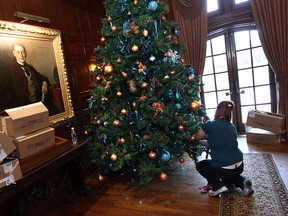 - A portrait keeps an eye on volunteers at Willistead Manor in Windsor on Monday, November 14, 2011. Local decorators and volunteers spent the day putting the christmas decorations up at the history house.                (TYLER BROWNBRIDGE / The Windsor Star)