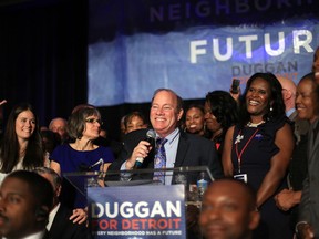 Detroit Mayor-elect Mike Duggan speaks to a crowd of supporters after being named the new mayor of the city of Detroit over Benny Napolean on Tuesday Nov. 5, 2013 at the Marriott Hotel in the Renaissance Center in downtown Detroit.  (AP Photo/Detroit Free Press, Ryan Garza)