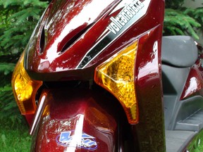 The front end of a red Volt Spyder e-bike is shown in this promotional image.