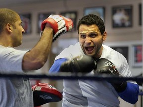 Samir El Mais, right, trains with coach Josh Canty at the Border City Boxing Club Tuesday.  El Mais is taking a break after suffering a jaw injury. (DAN JANISSE/The Windsor Star)