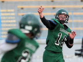 Lajeunesse quarterback Ben Rae, right, throws a pass during WECSSAA boys football  playoff action against Assumption at Windsor Stadium on November 4, 2013. (JASON KRYK/The Windsor Star)