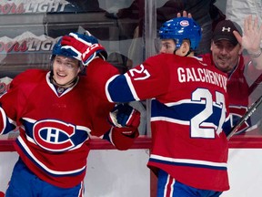Montreal's Brendan Gallagher, left, celebrates with Alex Galchenyuk after scoring a goal against the New York Islanders Sunday, November 10, 2013 in Montreal. The Candiens won 4-2. (THE CANADIAN PRESS/Paul Chiasson)