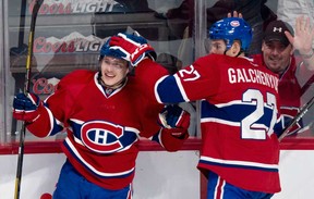 Montreal's Brendan Gallagher, left, celebrates with Alex Galchenyuk after scoring a goal against the New York Islanders Sunday, November 10, 2013 in Montreal. The Candiens won 4-2. (THE CANADIAN PRESS/Paul Chiasson)