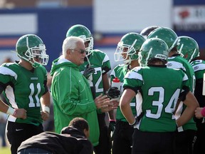 Herman head coach Harry Lumley, centre, talks with his team during a game against the Sandwich Sabres last season. The Green Griffins will face Upper Canada College in next week's OFSAA Western Bowl in Toronto.  (JASON KRYK/ The Windsor Star)