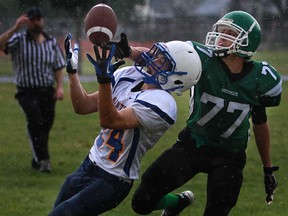 Herman's Aaron Butler, right, battles St. Anne's Alex Bornais during WECSSAA football action at Herman. The Green Griffins face Upper Canada College in in the OFSAA West Bowl Wednesday in Toronto.  (DAX MELMER/The Windsor Star)