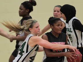 Lajeunesse's Jenna Henry, left, chases Maranatha's Jade Griffiths during the WECSSAA senior girls A basketball final at Lajeunesse. (JASON KRYK/The Windsor Star)