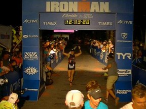 Star reporter Kelly Steele crosses the finish line Saturday in the Ironman Florida triathlon. She covered 140.6 miles in 12 hours 13 minutes 20 seconds.