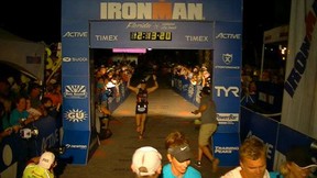 Star reporter Kelly Steele crosses the finish line Saturday in the Ironman Florida triathlon. She covered 140.6 miles in 12 hours 13 minutes 20 seconds.