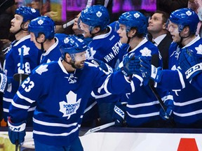 Toronto's Trevor Smith, front, celebrates his goal against the New York Islanders during first period NHL action in Toronto, Tuesday November 19, 2013. (THE CANADIAN PRESS/Mark Blinch)