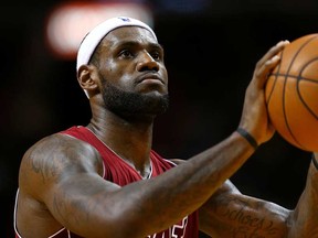 Miami's LeBron James shoots a foul shot against Phoenix at American Airlines Arena on November 25, 2013 in Miami. (Mike Ehrmann/Getty Images)