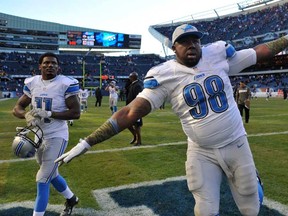 Detroit's Nick Fairley , right, celebrates after the Lions' 21-19  victory against the Bears on November 10, 2013 at Soldier Field in Chicago. (David Banks/Getty Images)