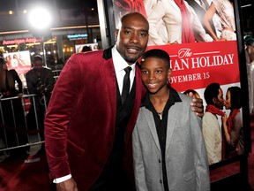 Actors Morris Chestnut, left, and Linden Liles-McCurdy arrive at the premiere of Universal Pictures' The Best Man Holiday at the Chinese Theatre on Nov. 5 in Los Angeles. (Kevin Winter / Getty Images)