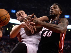 Miami's Udonis Haslem, right, and Toronto's Jonas Valanciunas battle for a rebound during NBA action in Toronto on Tuesday Nov. 5, 2013. (THE CANADIAN PRESS/Frank Gunn)